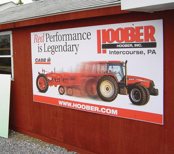 A large-format Hoober dealer sign Weber printed, mounted on the dealership