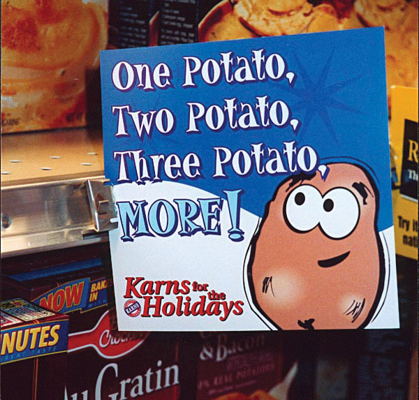 A Karns Foods shelf talker Weber designed and printed, on the shelf in the store