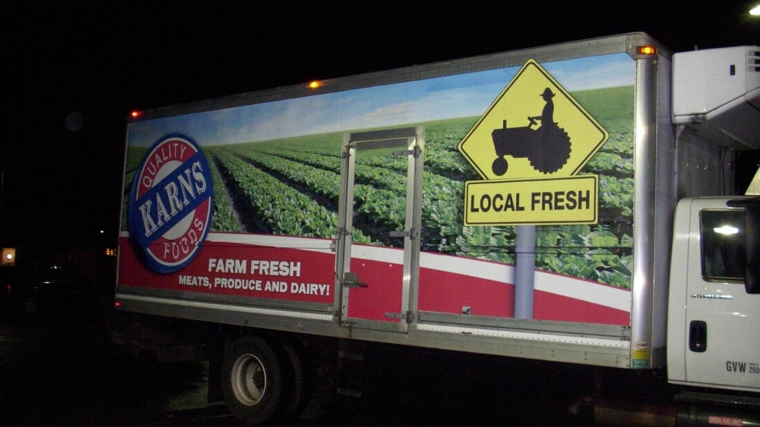 A Karns Foods delivery truck fully wrapped in farm-fresh vinyl graphics by Weber Advertising